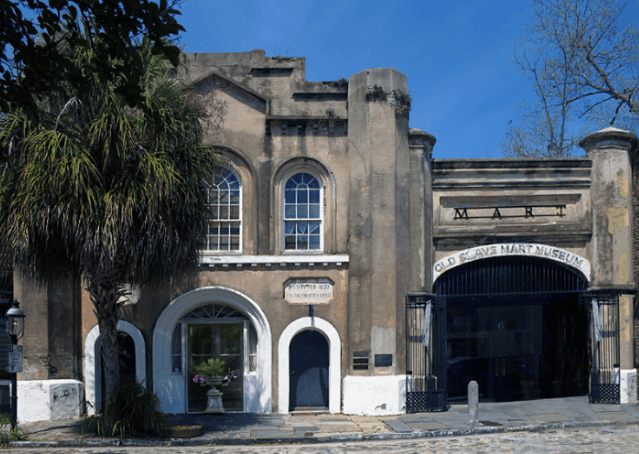 Exterior facade of the historic Old Slave Mart Museum on Chalmers Street in Charleston, South Carolina.